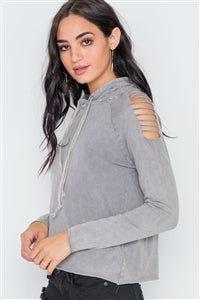 Image of a grey stonewash hoodie with laser cutouts on the shoulder to create a distressed look.