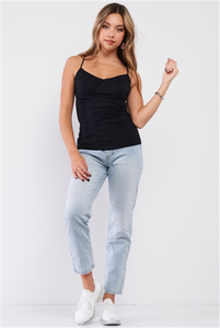 Young woman in jeans and the black, back cami top from Charmed & Fortunate’s online clothing store.